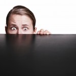 istock_hiding_behind_desk.70112828